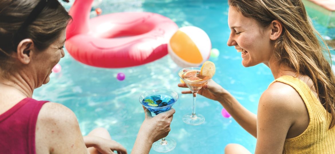 Relaxing pool party with clean, crystal-clear water using Clear Comfort AOP water treatment system and low-chlorine pool water care