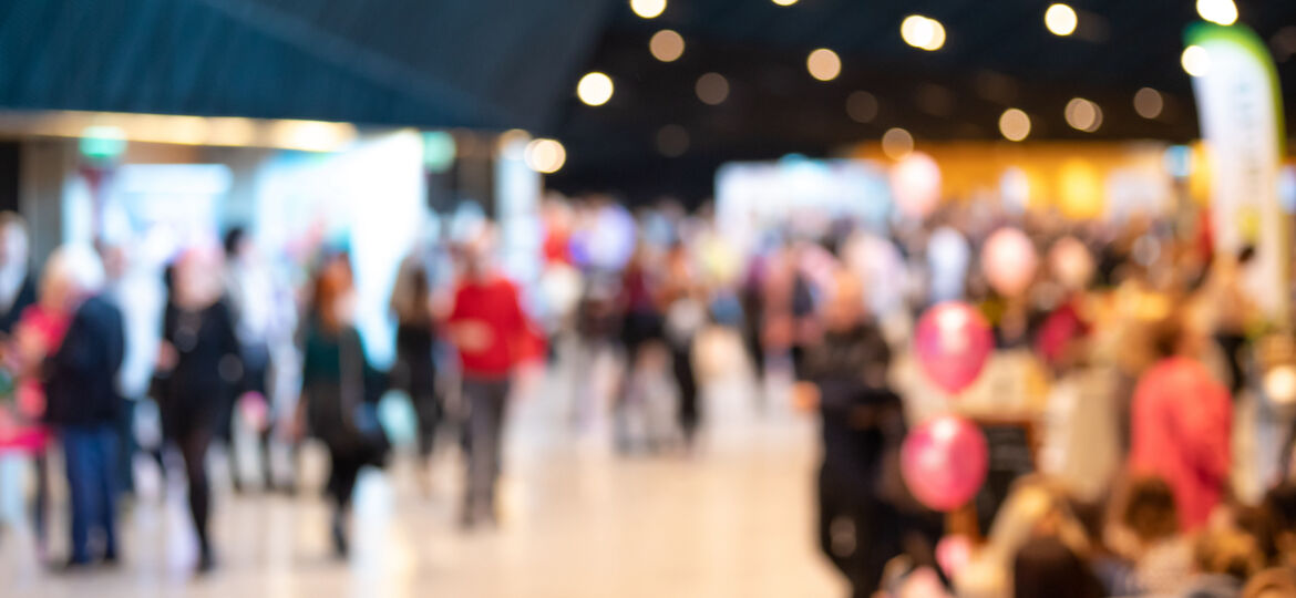 Blurred crowd of people in modern interior during event