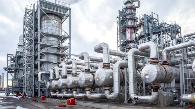 Heat exchanger at an oil refinery with AOP cooling tower water treatment.